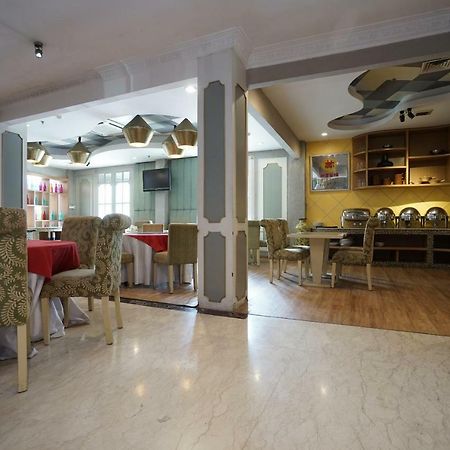 Capital O 1128 Hotel Imara Palembang Eksteriør bilde