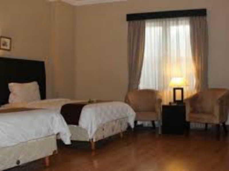 Capital O 1128 Hotel Imara Palembang Eksteriør bilde